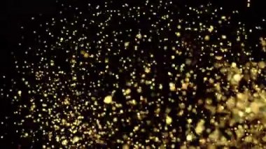 Parlayan altın folyo ve parıldayan ağır çekimde yüksek hızda çekim