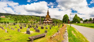 Panorama of Heddal stave church and the cemetery, Telemark, Norway clipart