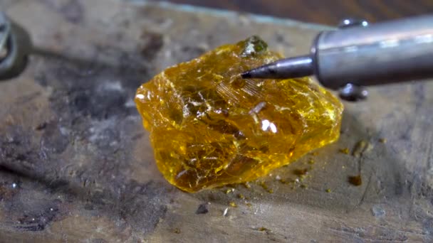 Soldering iron ready to work melting rosin — Stock Video