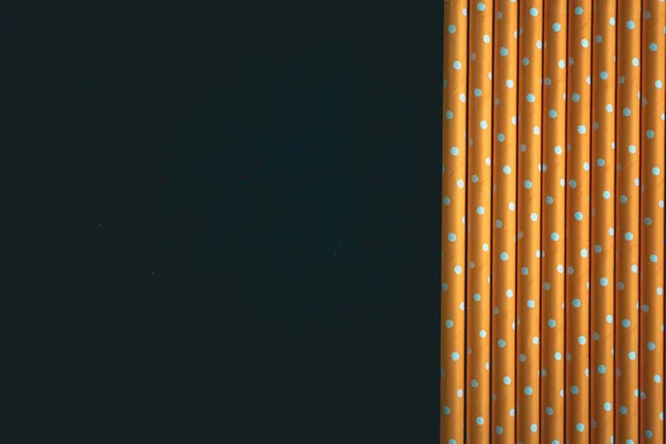 Yellow paper straws background