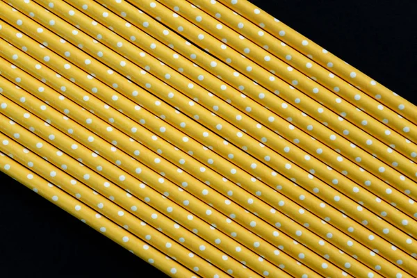 Yellow paper straws background