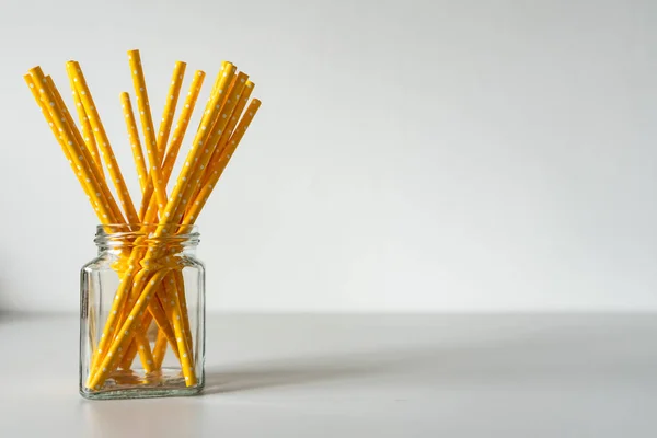 Yellow paper straws isolated, pollution problem