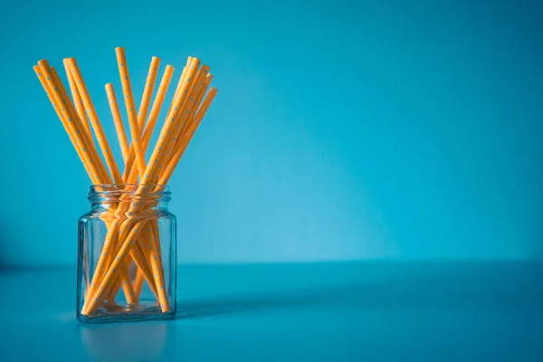 Yellow paper straws isolated, pollution problem