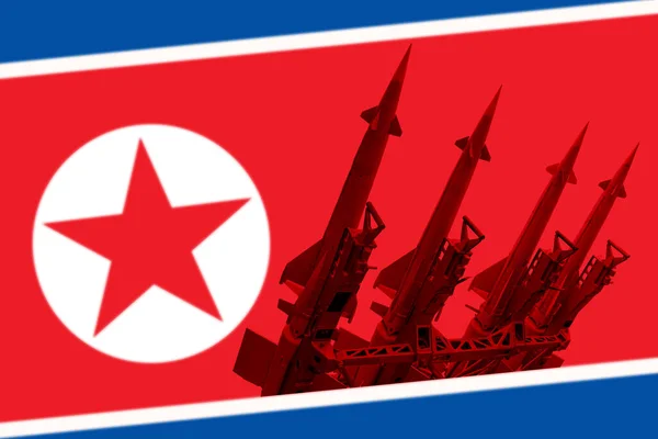 北朝鮮の国旗を背景にした対空ミサイルシステム 打ち上げ準備ができている4つのロケット地球空気 — ストック写真