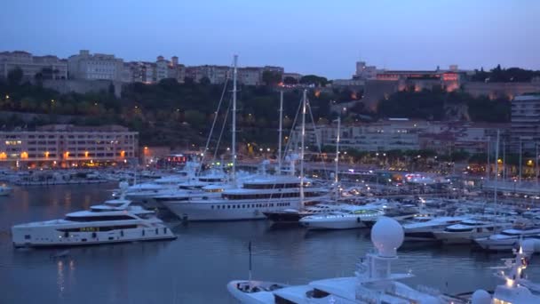 Yachts in Monaco and night lights - Pan — Stock Video
