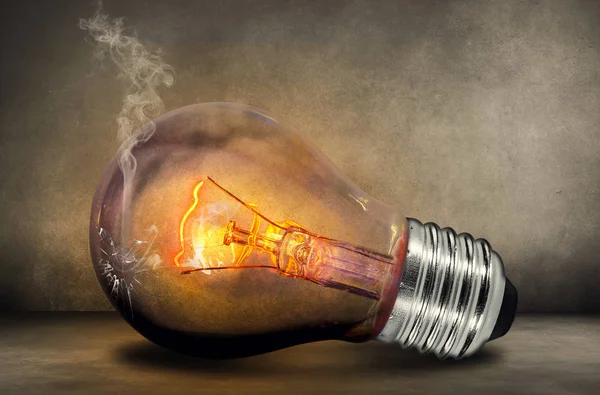 Light bulb with hanging lights background stock photo