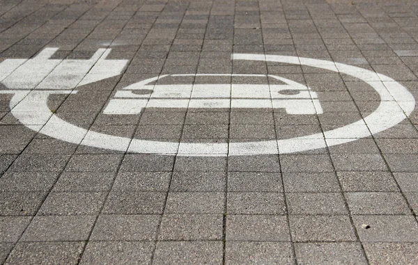 Electric car sign on road. Pictogram at the parking place. Car charging icon.