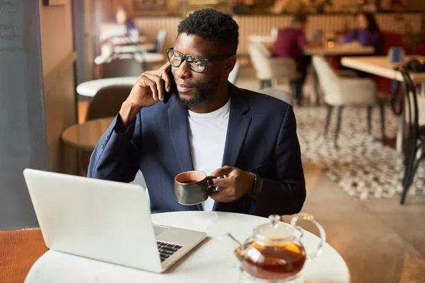 Businessman working from cafe