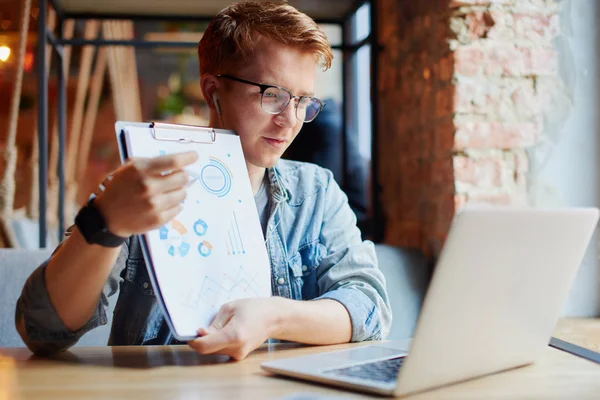 Man having a business conversation on the laptop.