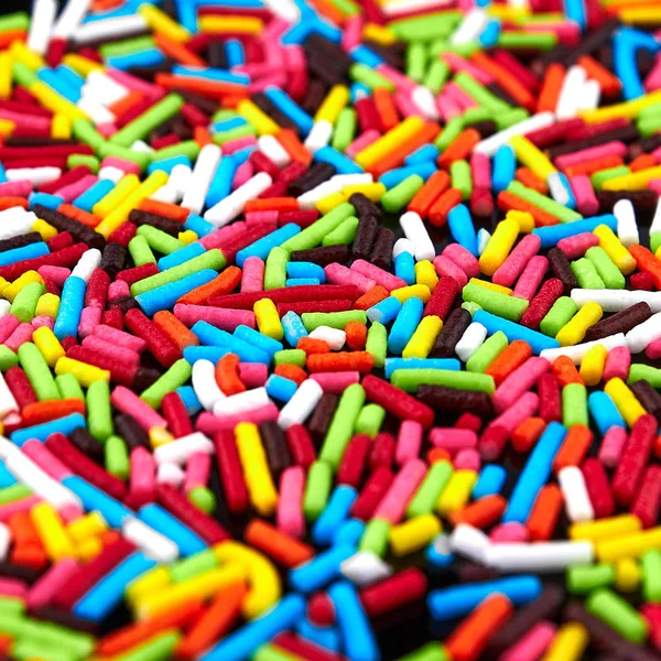 Fondo brillante colorido, palos multicolores. Dulce bonito fondo caramelo . — Foto de Stock