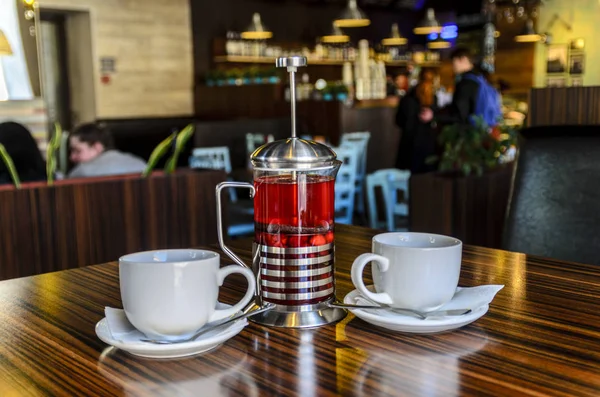 a pleasant meeting of friends in the cafe for a Cup of delicious fruit and berry tea