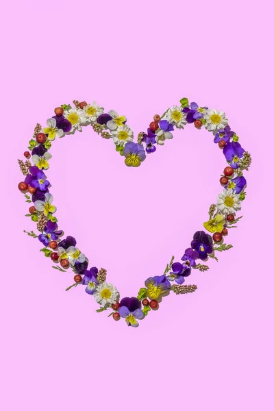 heart from flowers isolated on pink, women\'s day and congratulations.