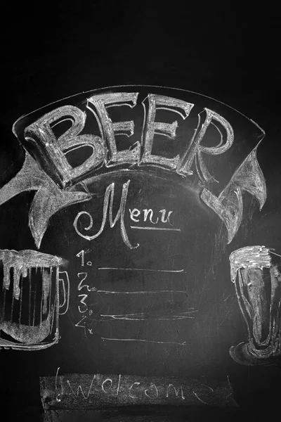 black bar advertising board with bar menu, crayon inscriptions and beer pattern.