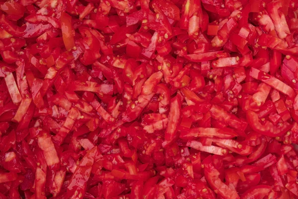 Yenilebilir yemek arka planı, doğranmış kırmızı domates, üst manzara.