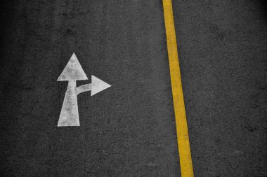 white arrow painted on asphalt road (Go straight and turn right) clipart