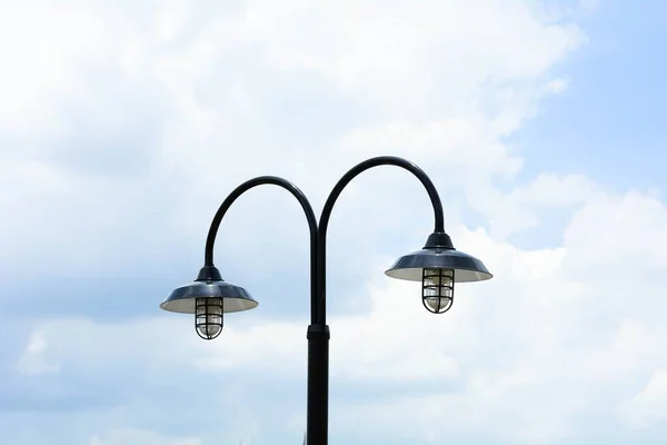 vintage street light on blue sky