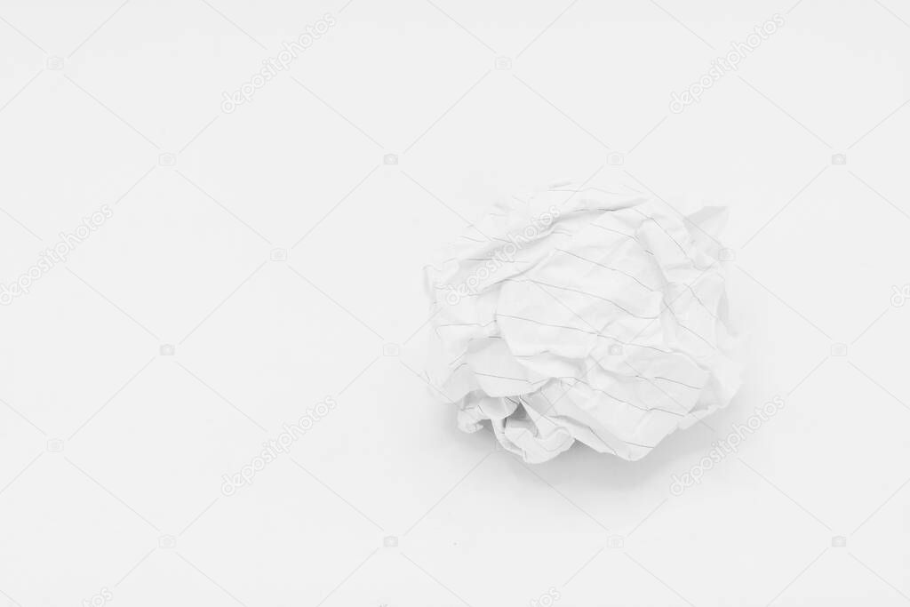 Screwed up piece of paper isolated on white background