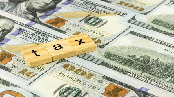 Tax Concept Wooden Block Dollar Bills — Stock Photo, Image