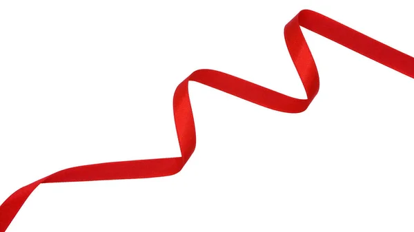 白い背景に孤立した赤い生地のリボンの螺旋 ロイヤリティフリーのストック画像