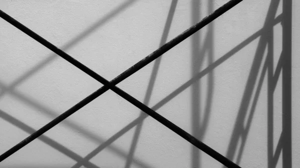 steel bar with shadow on the wall