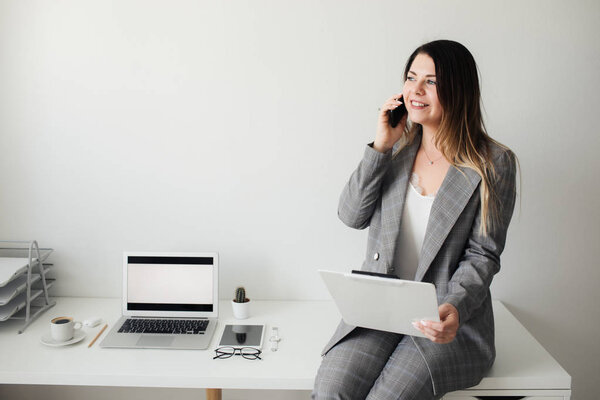 younger girl working in the office at the table