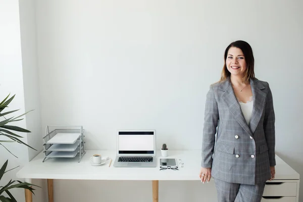 stock image younger girl working in the office at the table