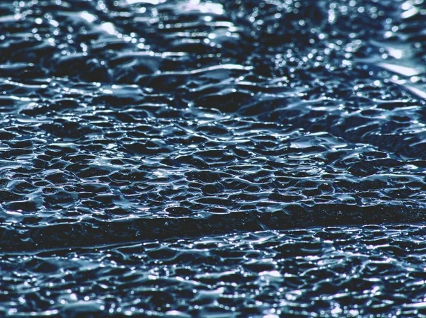 Climate change. Detail of glacier melting  in bay. Spring landscape with melting of ice floe.