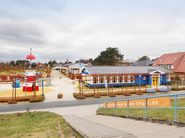 Zingst  ermany - January 25 2018:  Lighthouse as attraction for kids, at sea promenade,  Darss peninsula, Fischland-Darss-Zingst, Germany clipart