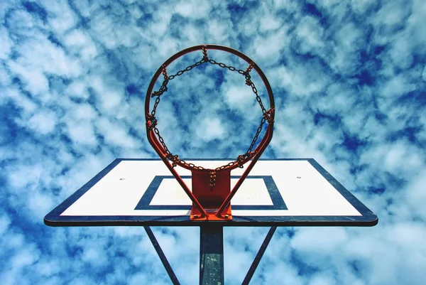 Basketball hoop on a blue sky background