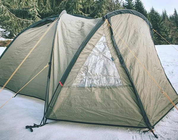 Camping on snow. Tent built in the fresh  snow. Spent few days on trek by snowshoes, travel within winter vacation