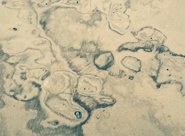 濡れた砂の堆積物は 自然種の絵を作成しました 柔らかく 滑らかで砂質の渦 — ストック写真