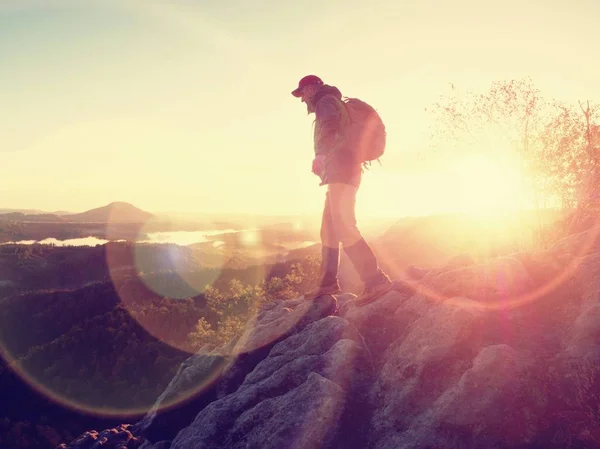 Man achieve the summit. Man on the peak alone with his minds, cloudy wheather