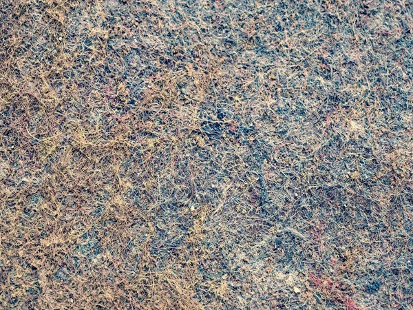 Used industrial carpet. Background from a fragment of worn ground cover