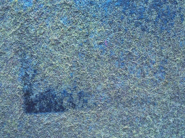 Used industrial carpet. Background from a fragment of worn ground cover