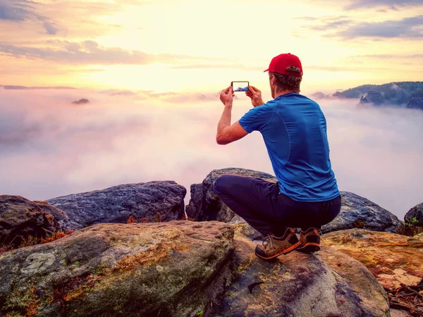 Hiker Takes Selfie Photo Fall Nature Adventure Man Sit Stone — Stock Photo, Image