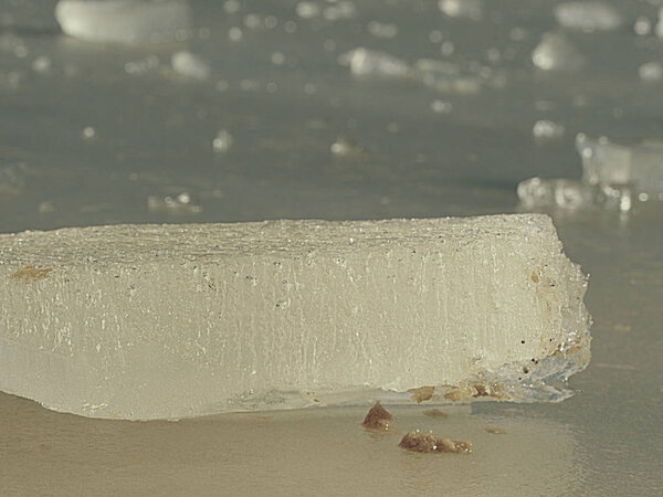 Fragment of a melting ice floe shape closeup.  Ice on river