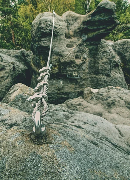 Climbing carabiner on a steel rope between peaks on via ferrata — Stock Photo, Image