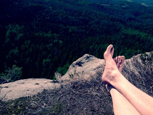 Naked man's legs relaxing in mountains with nice view — Stock Photo, Image