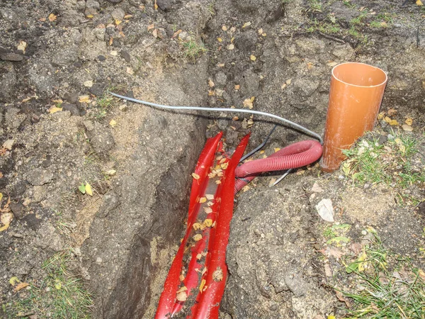 Steel wire in protective lplastipipe under ground.  Construction Area — Stock Photo, Image