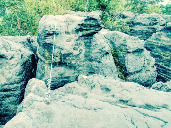 Climbing carabiner on a steel rope between peaks on via ferrata — Stock Photo, Image