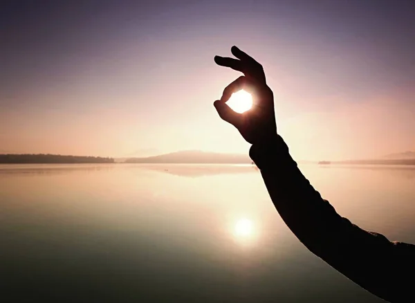 Silhouette of shadow shape being made by hands with sunlight — Stock Photo, Image