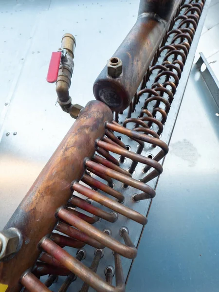 Brass heat radiator and industrial cooler detail. Ribbed box cooling water in air blowing tower.