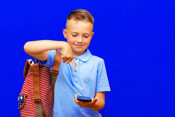 Smiling Schoolboy Casual Clothes Backpack Isolated Bright Blue Background Point — Stock Photo, Image