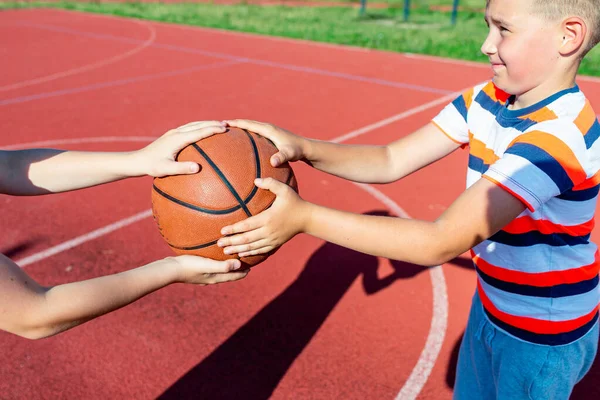 Attractive Caucasian Two Little Basketball Players Holds Ball Outdoors Red — Stock Photo, Image