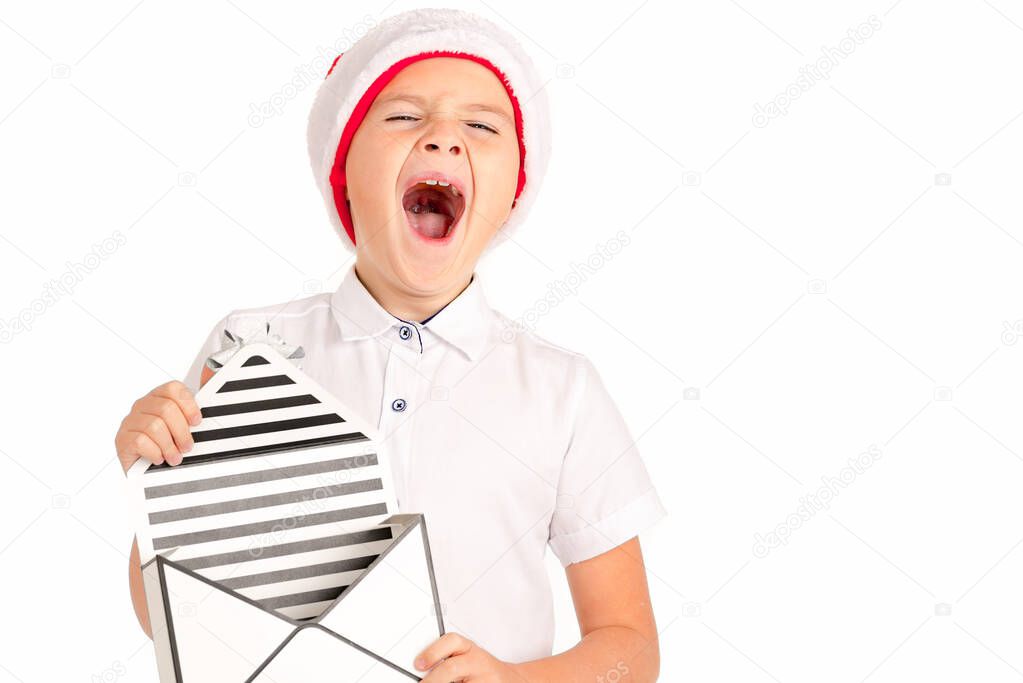 Child holding Christmas gift box in his hand. Isolated on white background shout out