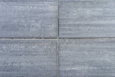 Çatlak ve macun lekeli eski gri beton duvar. Gri arka plan.