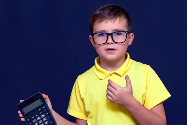 Close Attractive Young Schoolboy Eyeglasses Yellow Shirt Holds Calculator Calculator — Stock Photo, Image