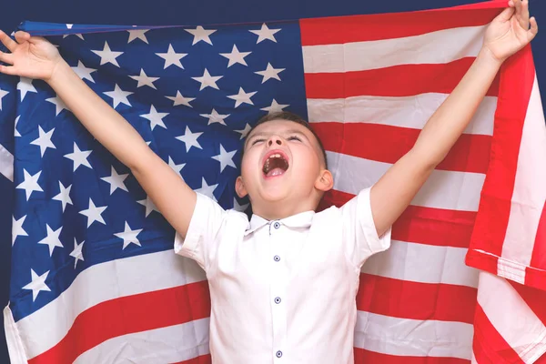 Boy Shouts Holding Big American Flag Blue Background — Stock Photo, Image