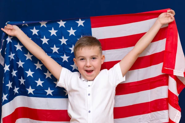 Boy Shouts Holding Big American Flag Blue Background — Stock Photo, Image