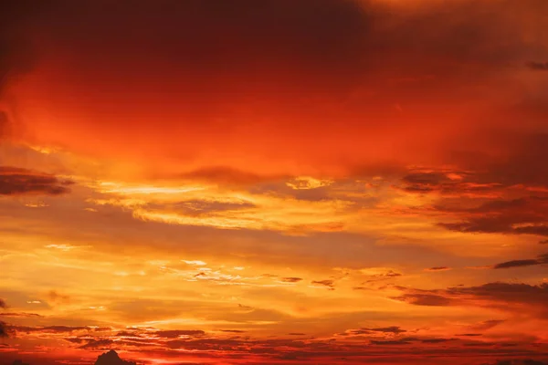 Beautiful bright colorful sky. Picture taken at sunset. Red-orange background with nice paints. Rare sunrise. Natural composition
